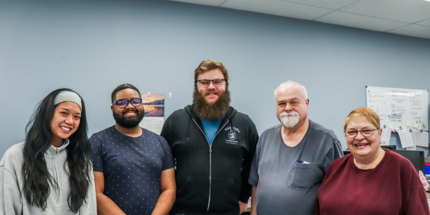 A photo of 5 Delta team members in the Beverly plant office.