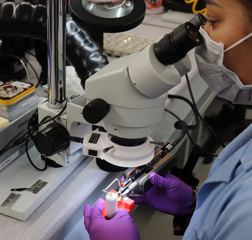 A Delta team member assembling a cable.