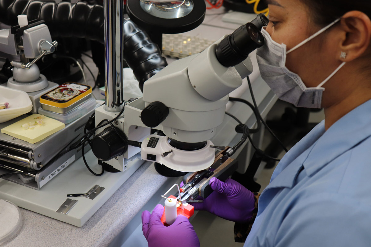 A Delta team member assembling a cable.