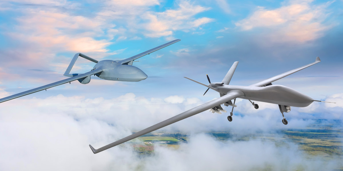 US Military drones conducting surveillance above clouds.