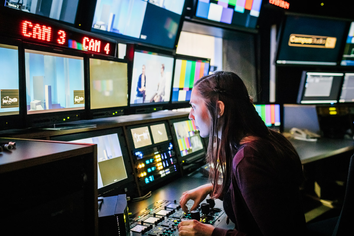 A person operating TV broadcast equipment.