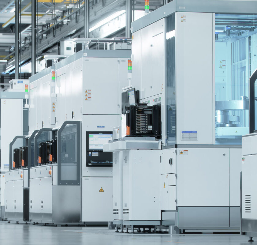 Semiconductor machines lined up in a plant.