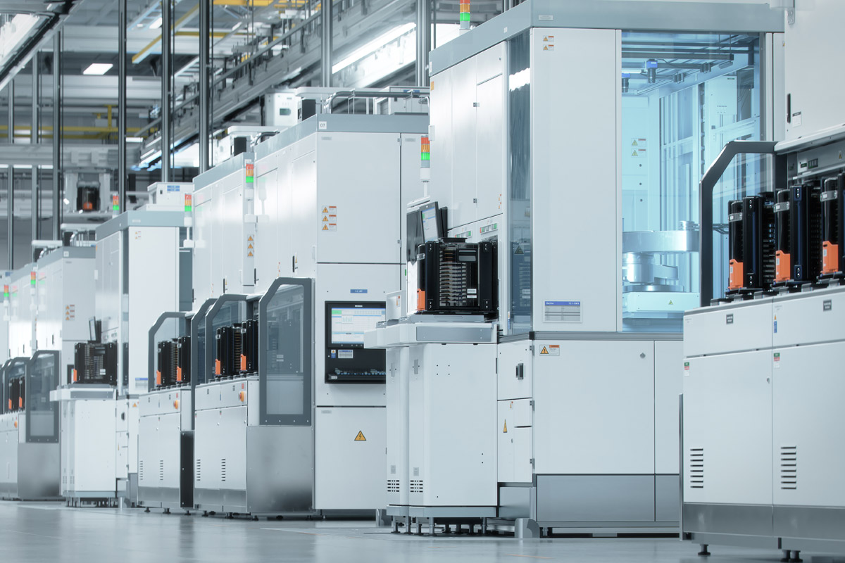 Semiconductor machines lined up in a plant.