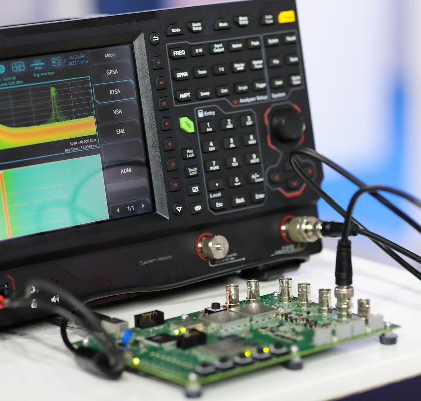 A machine conducting semiconductor chip testing.