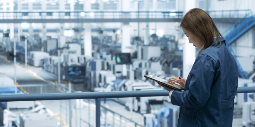 An engineer overlooking semiconductor performance in a facility.