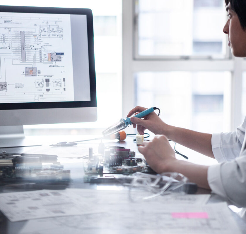 A scientist conducting a test in a lab.