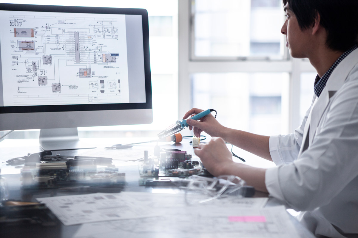 A scientist conducting a test in a lab.